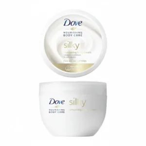 Vue de dessus et de face d'un pot de crème pour le corps Dove Silky de 300 ml, avec sa texture onctueuse visible.