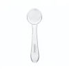 Brosse visage Titania blanche et transparente, poils doux, manche ergonomique pour peeling et nettoyage.