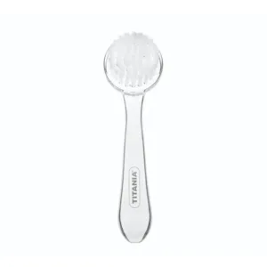 Brosse visage Titania blanche et transparente, poils doux, manche ergonomique pour peeling et nettoyage.
