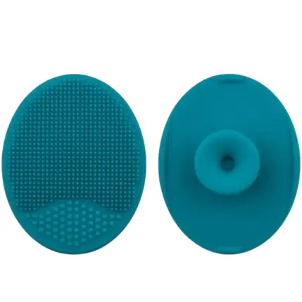 Pads Nettoyage Pinceaux Silicone Turquoise (2‑en‑1 Pratique) Deux pads ovales en silicone turquoise : l’un texturé à picots fins et gros, l’autre lisse avec ventouse centrale, sur fond clair.