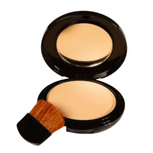 Boîtier noir compact de poudre illuminatrice Yves Morel Highlighting Powder N°41 ouvert, avec un pinceau de maquillage.