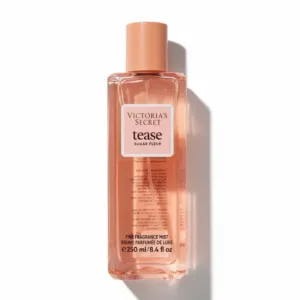 Brume Victoria’s Secret Tease Sugar Fleur 250 ml sur table en bois, flacon rose élégant et lumineux.