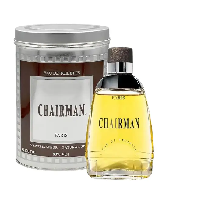Chairman Homme 100 ml (Élégance Classique & Force Moderne) Flacon Chairman 100 ml transparent à bouchon gris, liquide ambré, avec étui cylindrique métal brun et argent.
