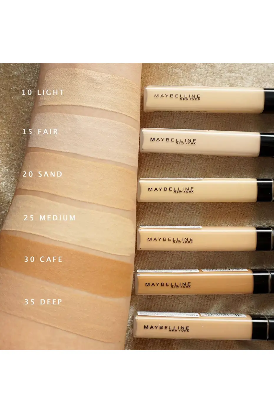 Toutes les Teintes Fit Me : Trouvez Votre Match Parfait ! Nuancier de l'anti-cernes Maybelline Fit Me. Six teintes sur l'avant-bras, du 10 Light au 35 Deep, montrant la variété.