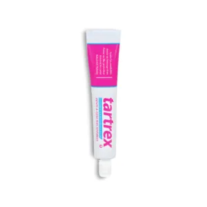 Tube de dentifrice TARTREX pour dents et gencives sensibles. Formule au potassium et fluor. Conditionnement rose et blanc.