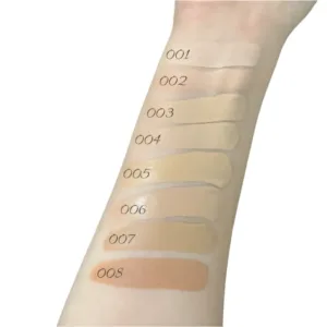 Swatches du fond de teint Topface Skin Twin sur un bras, nuances 001 à 008 montrant les tons beige et dorés.