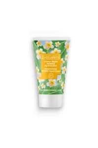 Tube de Crème Mains Monoï Evoluderm 50ml décoré de fleurs de tiaré et feuilles de palmier, fabriqué en France.