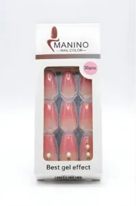 Boîte de 30 faux ongles Manino dégradé rose et nude, effet gel brillant avec ornements perles et strass dorés sur fond blanc.