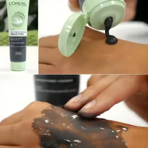 Tube L'Oréal Argile Pure et application de la texture gel noire détoxifiante sur le dos d'une main.