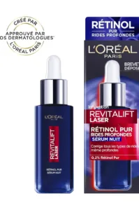 Flacon bleu de sérum nuit L'Oréal Revitalift Laser au rétinol pur 0,2% avec sa boîte, posé sur un fond blanc et bleu.