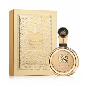 Flacon de parfum doré rond Lattafa Fakhar pour femme et sa boîte cadeau dorée assortie sur fond blanc.